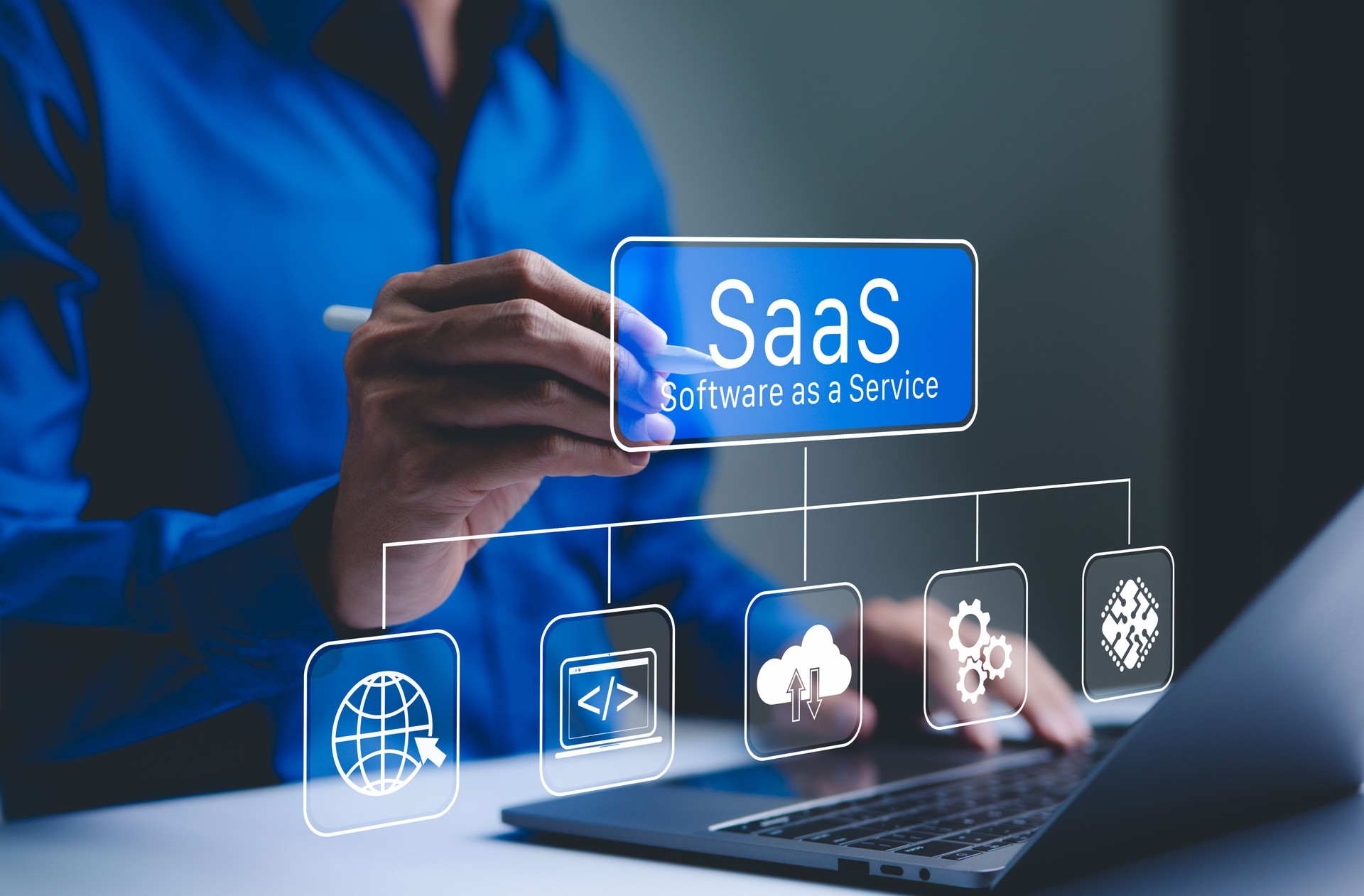 SaaS Concept, Software as a Service, A person interacts with a digital interface SaaS (Software as a Service) and various cloud-based icons, represent software management and cloud computing services.